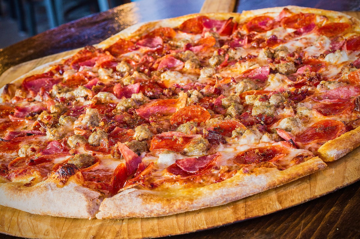 The Elbow meat-lover pizza piled with pepperoni, salami, bacon and sausage