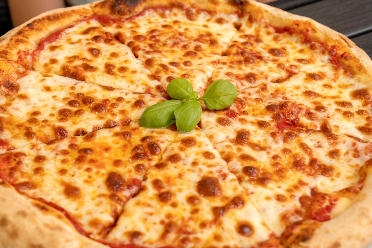 Classic cheese pizza with house sauce and melted mozzarella